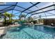 Inviting screened pool with spa and water features at 1910 Oregon Trl, Englewood, FL 34224