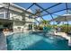 Expansive pool and patio area with outdoor kitchen at 1910 Oregon Trl, Englewood, FL 34224