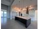 Modern kitchen with large island and white cabinets at 5061 Collingswood Blvd, Port Charlotte, FL 33948