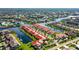 Aerial view of a waterfront residential community with canals, docks, and vibrant landscaping at 3830 Bal Harbor Blvd # 9, Punta Gorda, FL 33950