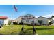 Villas of Bal Harbor community sign featuring lush landscaping and an American flag at 3830 Bal Harbor Blvd # 9, Punta Gorda, FL 33950