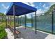 Relax under the covered seating while enjoying pickleball at 360 Ariano Ave, Nokomis, FL 34275