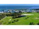 Stunning aerial view of the golf course and marina at 3040 Grand Bay Blvd # 283, Longboat Key, FL 34228