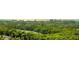 Aerial view of lush tropical landscape and waterway at 3040 Grand Bay Blvd # 283, Longboat Key, FL 34228