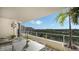 Spacious balcony with outdoor furniture and scenic view at 3040 Grand Bay Blvd # 283, Longboat Key, FL 34228