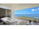 Relaxing balcony with water views and lounge chairs at 3040 Grand Bay Blvd # 283, Longboat Key, FL 34228