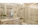 Elegant bathroom with a frameless shower and modern vanity at 3040 Grand Bay Blvd # 283, Longboat Key, FL 34228