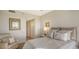 Guest bedroom with a queen-size bed and calming decor at 3040 Grand Bay Blvd # 283, Longboat Key, FL 34228