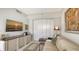 Comfortable den featuring a sofa, TV, and built-in shelving at 3040 Grand Bay Blvd # 283, Longboat Key, FL 34228