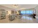 Spacious living room with water views and modern furnishings at 3040 Grand Bay Blvd # 283, Longboat Key, FL 34228