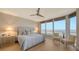 Large bedroom with water views and light wood floors at 3040 Grand Bay Blvd # 283, Longboat Key, FL 34228