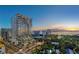 Aerial view of a modern high rise building at sunset by the water at 668 Quay Commons # 504, Sarasota, FL 34236