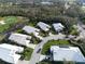 Aerial view of the community with houses and lush greenery at 326 Saint George Ct # 14, Venice, FL 34293