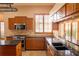 Modern kitchen with stainless steel appliances and granite countertops at 326 Saint George Ct # 14, Venice, FL 34293