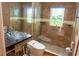 Spa-like bathroom with glass shower, modern toilet, and stained glass window at 326 Saint George Ct # 14, Venice, FL 34293