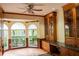 Spacious office with built-in cabinetry, granite counter, and arched windows at 326 Saint George Ct # 14, Venice, FL 34293