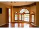Bedroom with hardwood floors and large windows at 326 Saint George Ct # 14, Venice, FL 34293