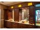 Elegant bathroom with double vanity and stained glass window at 326 Saint George Ct # 14, Venice, FL 34293