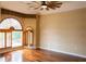 Primary bedroom with hardwood floors and large windows at 326 Saint George Ct # 14, Venice, FL 34293