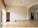 Large living room with tile floors and access to other rooms at 326 Saint George Ct # 14, Venice, FL 34293