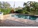 Inviting pool with a compass design and brick pavers at 326 Saint George Ct # 14, Venice, FL 34293