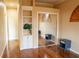 Hardwood floor bedroom with mirrored closet and built-in shelving at 326 Saint George Ct # 14, Venice, FL 34293