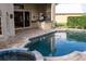 Relaxing pool and spa with brick pavers and covered patio at 326 Saint George Ct # 14, Venice, FL 34293