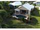 Aerial view of house, pool, and surrounding landscape at 326 Saint George Ct # 14, Venice, FL 34293