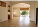 Bright living room with tile floors, kitchen, and pool access at 326 Saint George Ct # 14, Venice, FL 34293