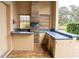 Outdoor kitchen features stainless steel appliances and a tiled countertop at 326 Saint George Ct # 14, Venice, FL 34293