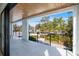 Balcony featuring porcelain tiles, a wood ceiling, and views of the surrounding landscape at 2111 Hawthorne St, Sarasota, FL 34239