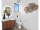 Contemporary bathroom featuring a sleek vanity, vessel sink, and illuminated mirror at 2111 Hawthorne St, Sarasota, FL 34239