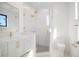 Modern bathroom featuring a glass shower, stylish vanity with gold fixtures, and a sleek toilet at 2111 Hawthorne St, Sarasota, FL 34239