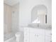 Bright bathroom featuring a glass shower, stylish vanity with marble countertop and modern fixtures at 2111 Hawthorne St, Sarasota, FL 34239