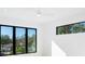 Bright bedroom with large windows offering natural light and views of the neighborhood at 2111 Hawthorne St, Sarasota, FL 34239