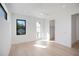 Bright bedroom with a ceiling fan, and light wood flooring with views of the outside at 2111 Hawthorne St, Sarasota, FL 34239