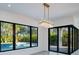 Bright dining area with pool view and sliding glass doors at 2111 Hawthorne St, Sarasota, FL 34239