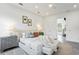 Bright main bedroom featuring a ceiling fan, artwork, and a neutral color scheme at 2111 Hawthorne St, Sarasota, FL 34239