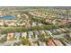 Aerial view of home in a lush community with lakes and green spaces at 12327 Thornhill Ct, Lakewood Ranch, FL 34202