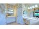 Double vanity bathroom with patterned wallpaper at 12327 Thornhill Ct, Lakewood Ranch, FL 34202