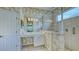 Bathroom with shower and patterned wallpaper at 12327 Thornhill Ct, Lakewood Ranch, FL 34202