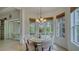 Charming dining area with a round table and chairs, bathed in natural light at 12327 Thornhill Ct, Lakewood Ranch, FL 34202