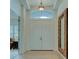 Bright entryway with double doors, a large mirror, and tile flooring at 12327 Thornhill Ct, Lakewood Ranch, FL 34202