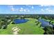 Aerial view of a green golf course with lakes and fairways at 12327 Thornhill Ct, Lakewood Ranch, FL 34202