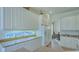 Bright kitchen featuring white cabinets, granite countertops, and a breakfast nook at 12327 Thornhill Ct, Lakewood Ranch, FL 34202