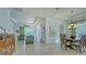 Open living and dining area with neutral walls and tile flooring at 12327 Thornhill Ct, Lakewood Ranch, FL 34202