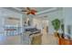 Open living room with a partial view of the kitchen and access to the entryway at 12327 Thornhill Ct, Lakewood Ranch, FL 34202