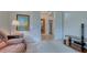 Home office with built-in shelving and comfortable seating at 12327 Thornhill Ct, Lakewood Ranch, FL 34202