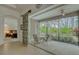 Relaxing screened patio with seating and view of mature landscaping at 12327 Thornhill Ct, Lakewood Ranch, FL 34202