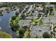 Aerial view of community tennis courts near a lake at 12327 Thornhill Ct, Lakewood Ranch, FL 34202